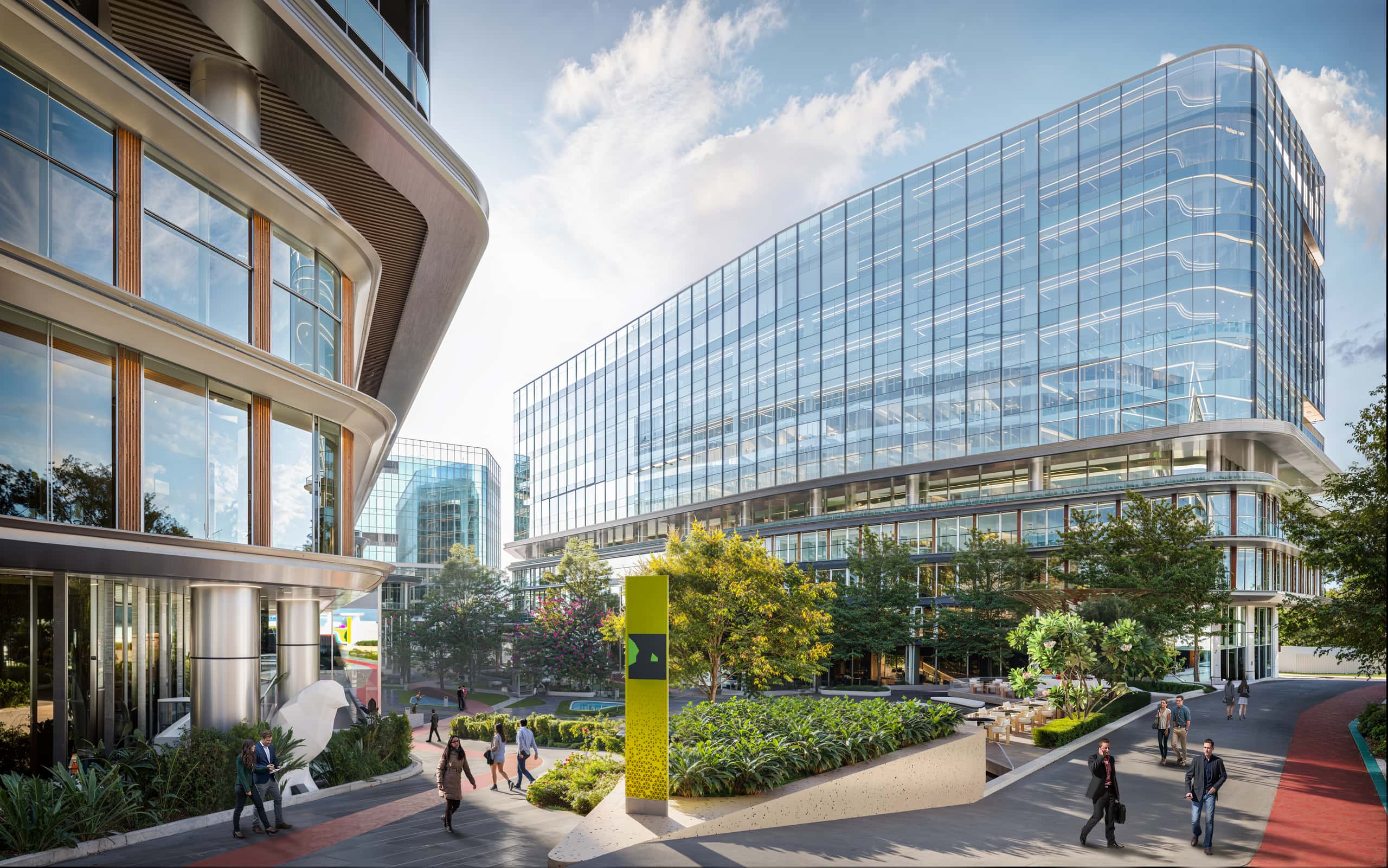 Arrival plaza leading to a triple-height lobby